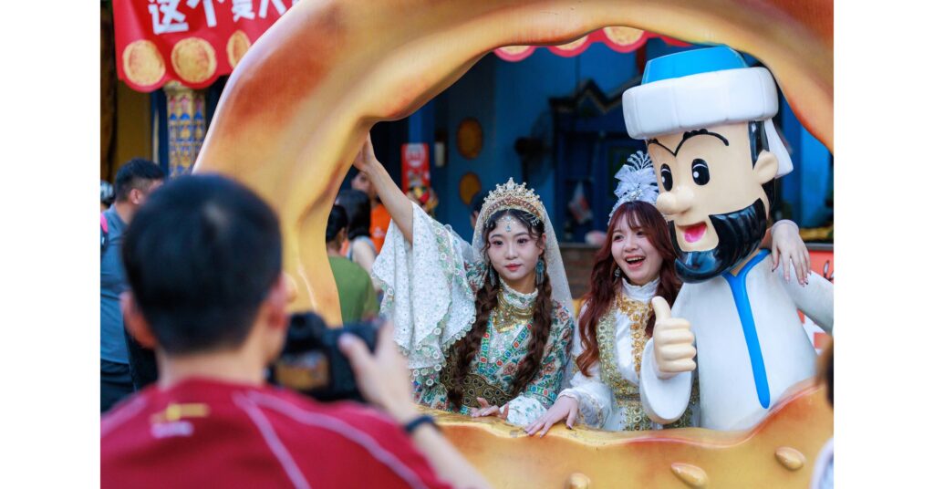 visitors take photos at the xinjiang international grand bazaar in urumqi.jpg